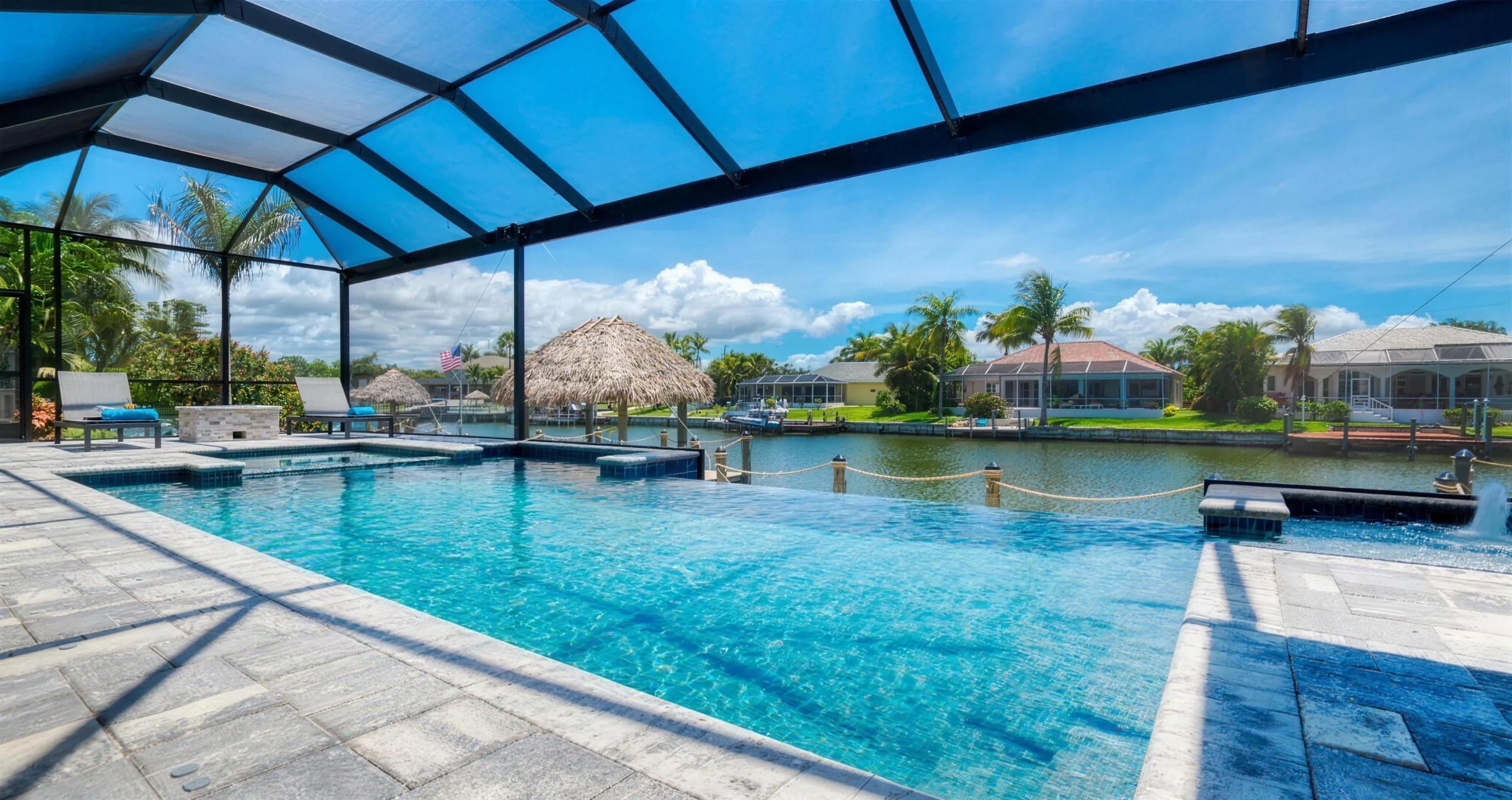 Swimming pool and screened terrace beside a residential canal in Cape Coral, Florida